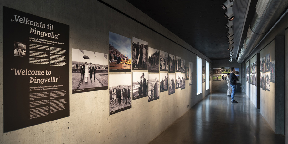 Two people look at the photo exhibit "Welcome to Þingvellir"