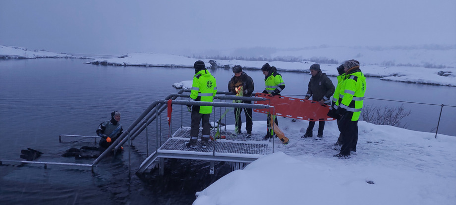 Rangers on safety and rescue course with paramedic by fissure Silfra