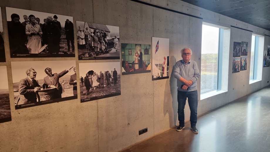 Photographer Gunnar Geir Vigfússon stands next to his photo exhibit "Welcome to Þingvellir"